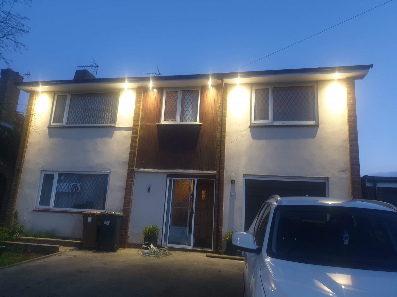 Residential property with new exterior lighting installed