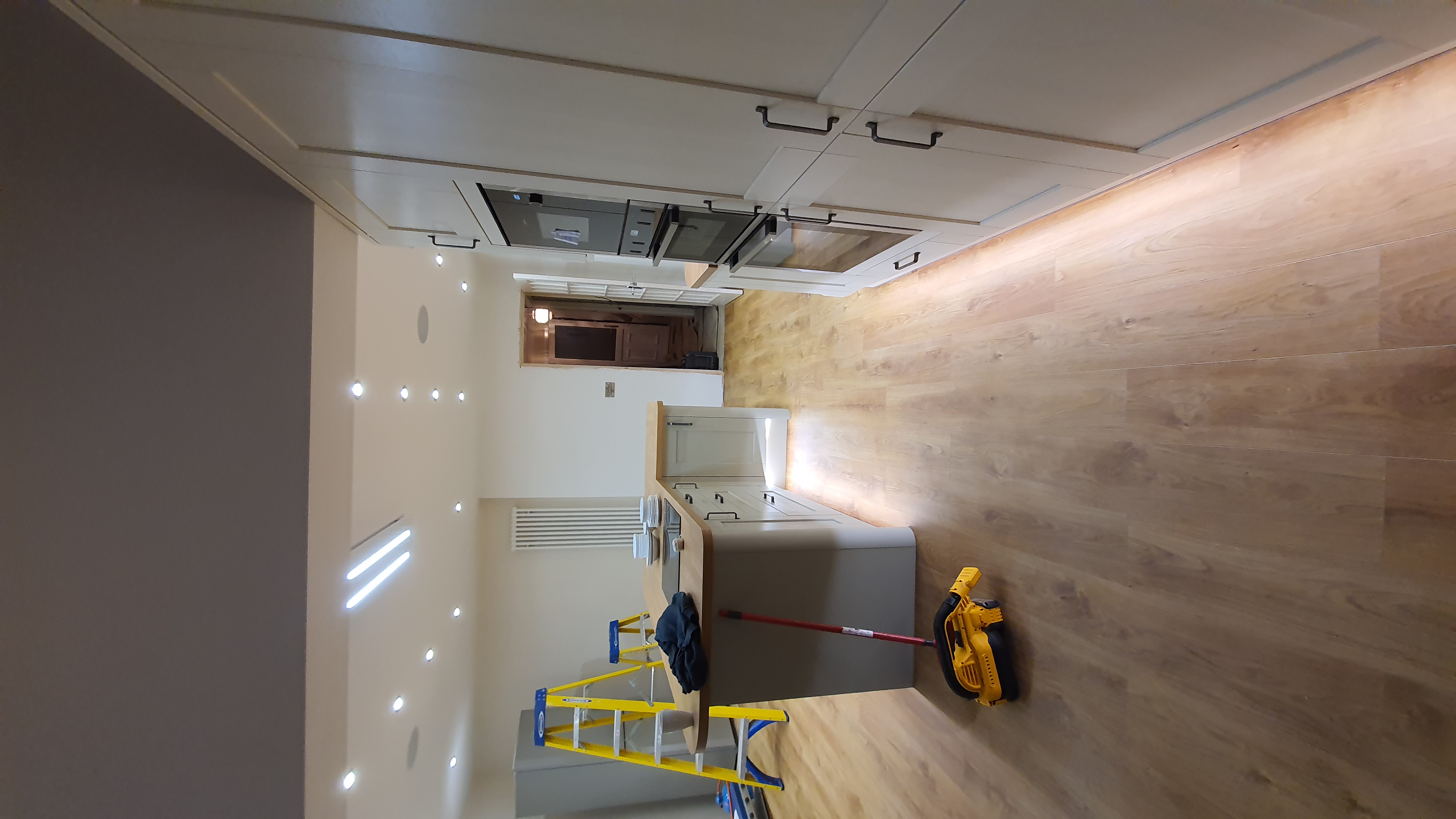 Modern kitchen with integrated LED downlights and island lighting